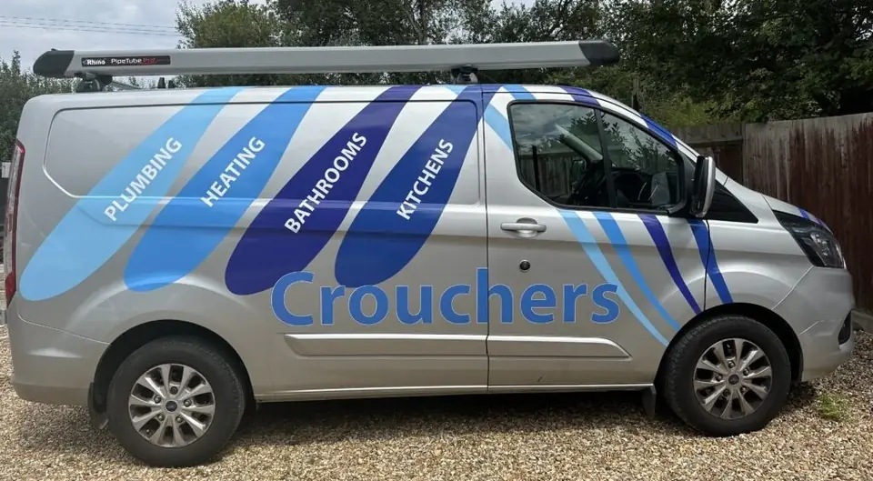 Crouchers van with plumbing, heating, bathrooms and kitchens on the side